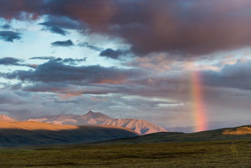 Midnight sky with rainbow over the Brooks Range from Toolik field station
