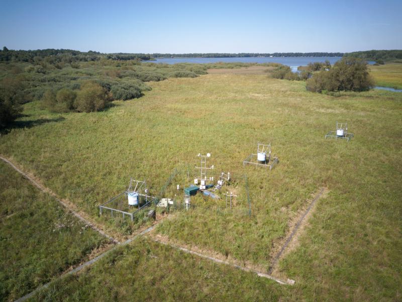 Floating pontoon with meteorological and eddy covariance instruments together with three automatic emission chambers in the sedge-grass marsh which is a part of the complex of wet meadows close to Třeboň town in Czechia.