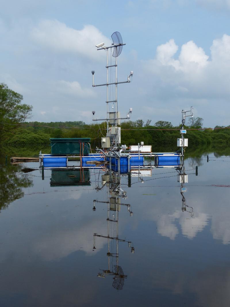 Floating pontoon with meteorological and eddy covariance instruments in the sedge-grass marsh under flood in June 2013.